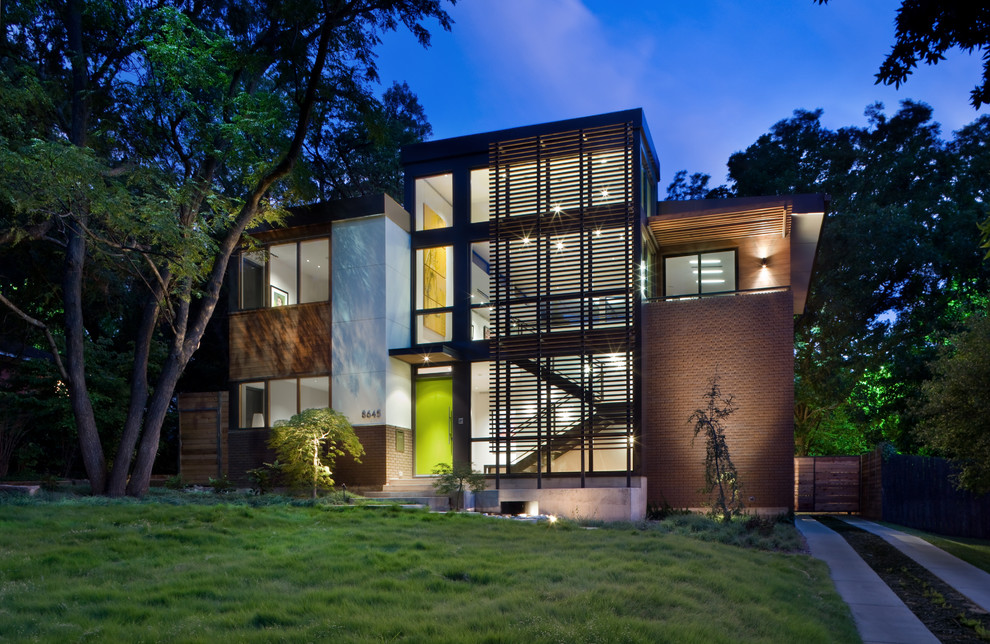 Photo of a contemporary two floor house exterior in Dallas with mixed cladding.