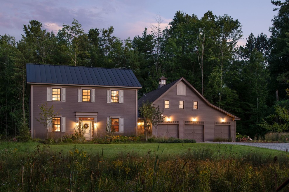 Inspiration for a farmhouse two-story house exterior remodel in Burlington with a metal roof