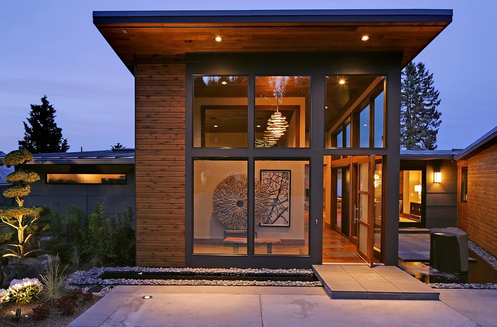 Large and gey contemporary two floor house exterior in Seattle with concrete fibreboard cladding.