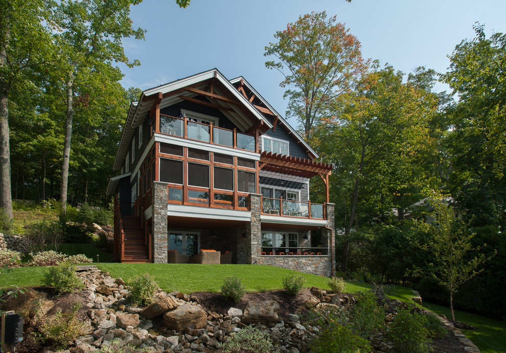This is an example of a rustic house exterior in New York with three floors.