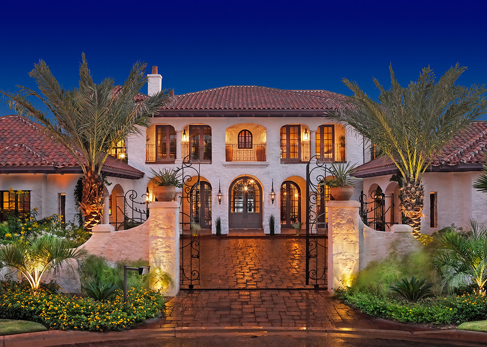 Photo of a mediterranean two floor house exterior in Austin.