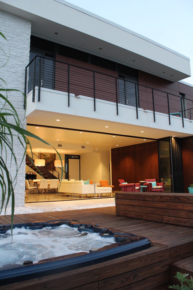 Design ideas for a large and white modern two floor house exterior in Tampa with mixed cladding and a flat roof.