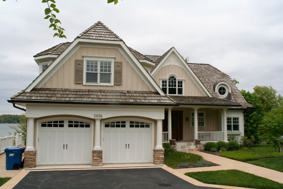 Example of a large eclectic beige three-story wood exterior home design in Indianapolis
