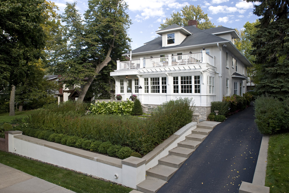 Traditional two-story exterior home idea in Minneapolis with a hip roof
