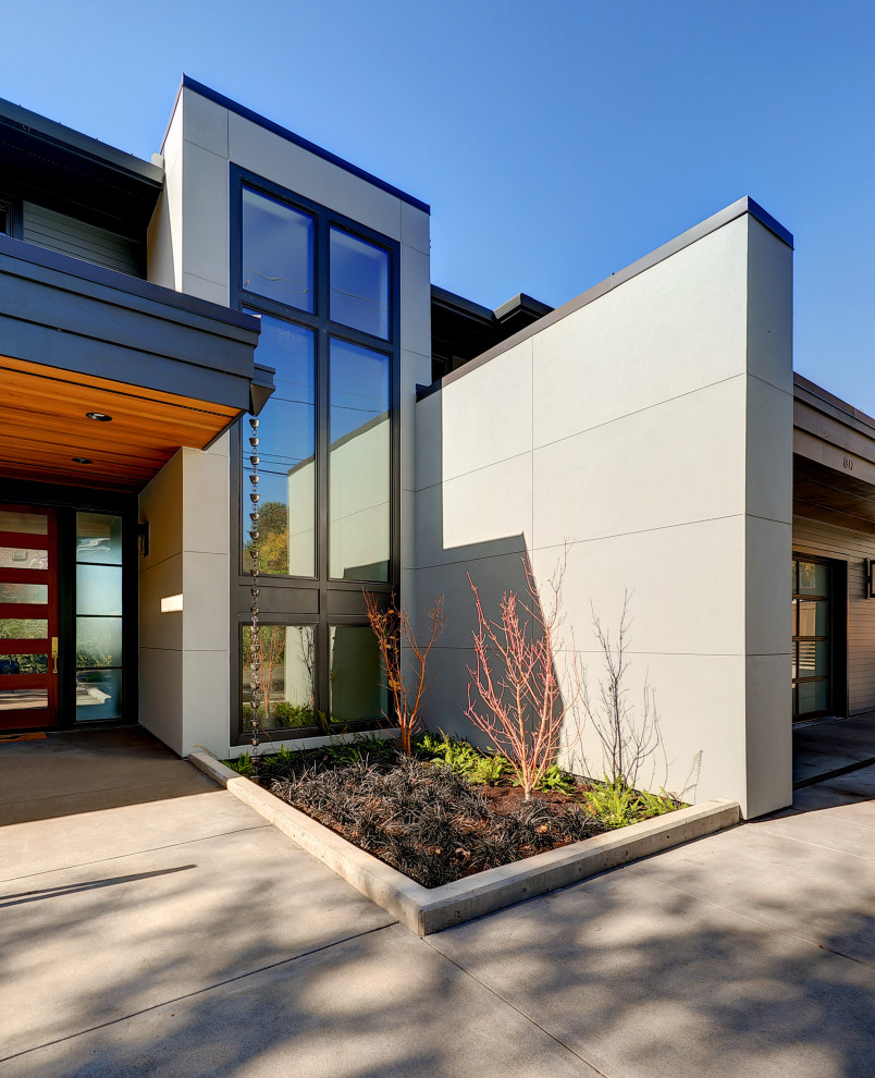 Large trendy gray two-story mixed siding exterior home photo in Portland with a metal roof