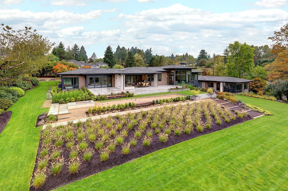 Inspiration for a large contemporary multicolored two-story mixed siding exterior home remodel in Portland with a green roof