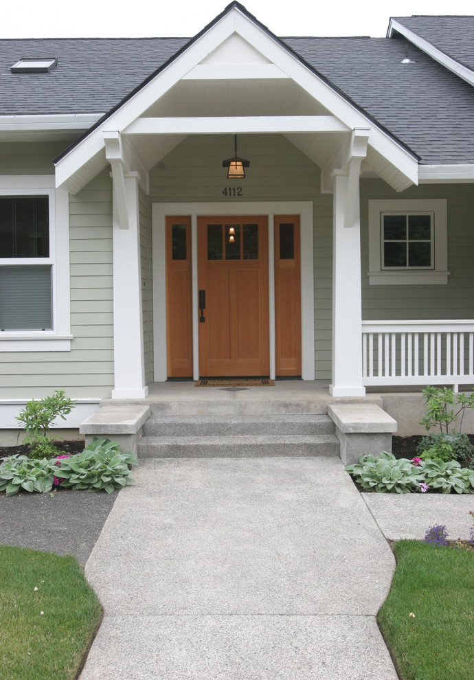 Inspiration for a timeless green two-story concrete fiberboard exterior home remodel in Portland