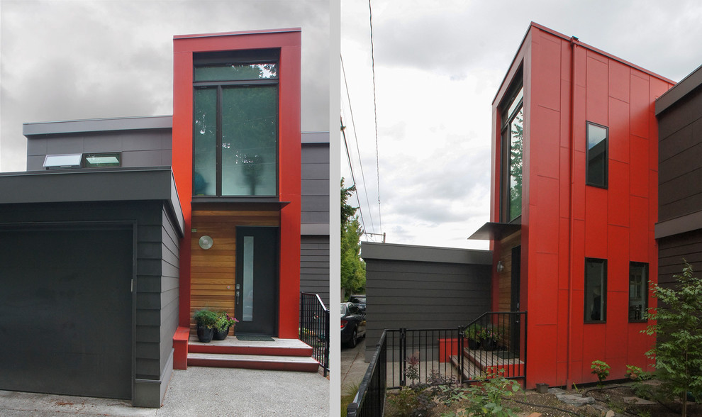 Cette photo montre une grande façade de maison rouge tendance en panneau de béton fibré à deux étages et plus avec un toit plat.