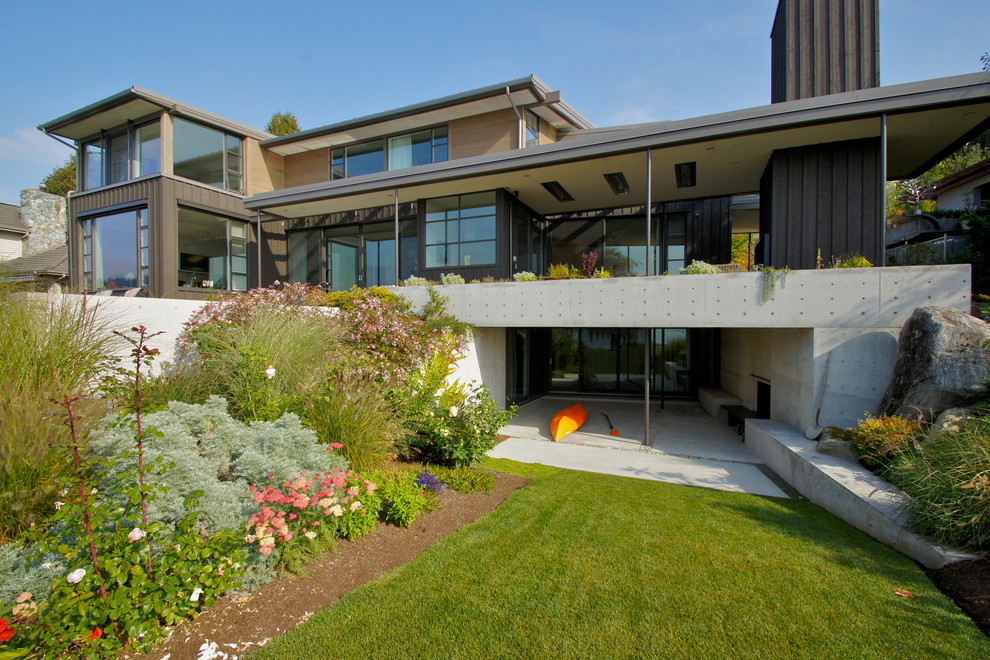 Brown contemporary concrete house exterior in Seattle with a lean-to roof.
