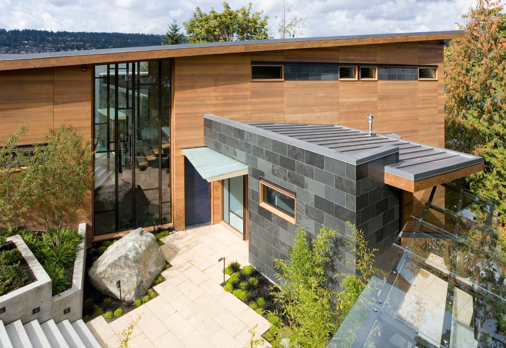 Example of a trendy wood exterior home design in Seattle
