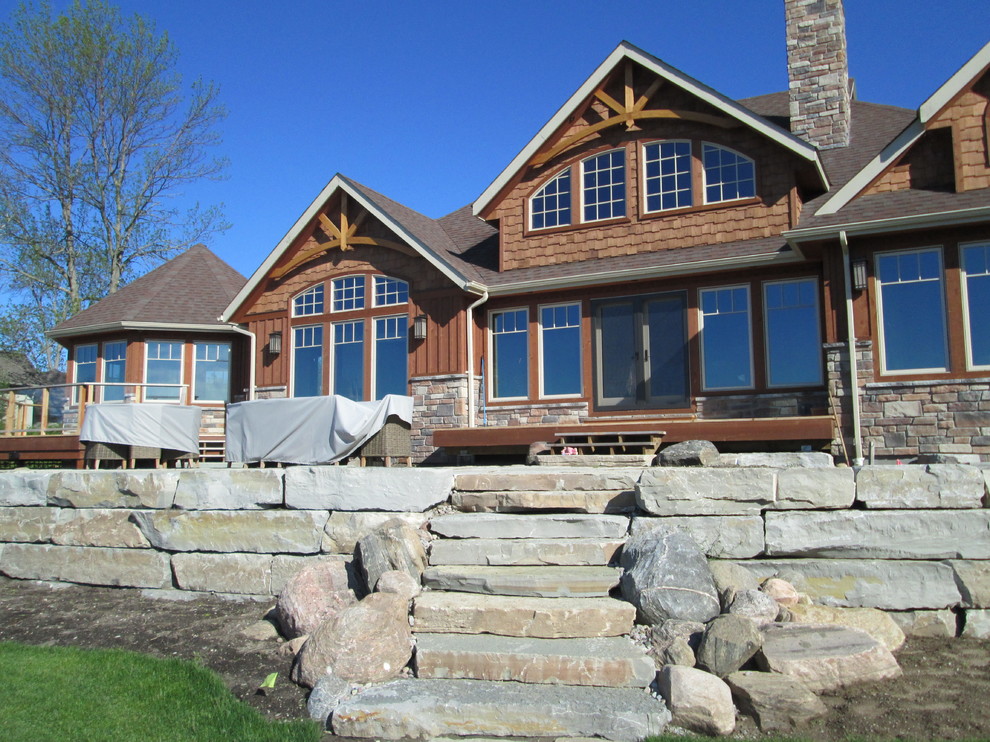 Lakefront Home with Cultured Stone Exterior - Rustic - Exterior