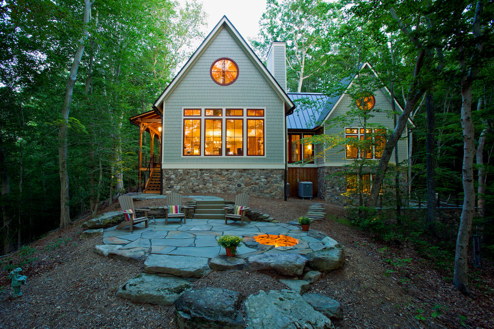 Large mountain style gray one-story wood exterior home photo in DC Metro with a metal roof
