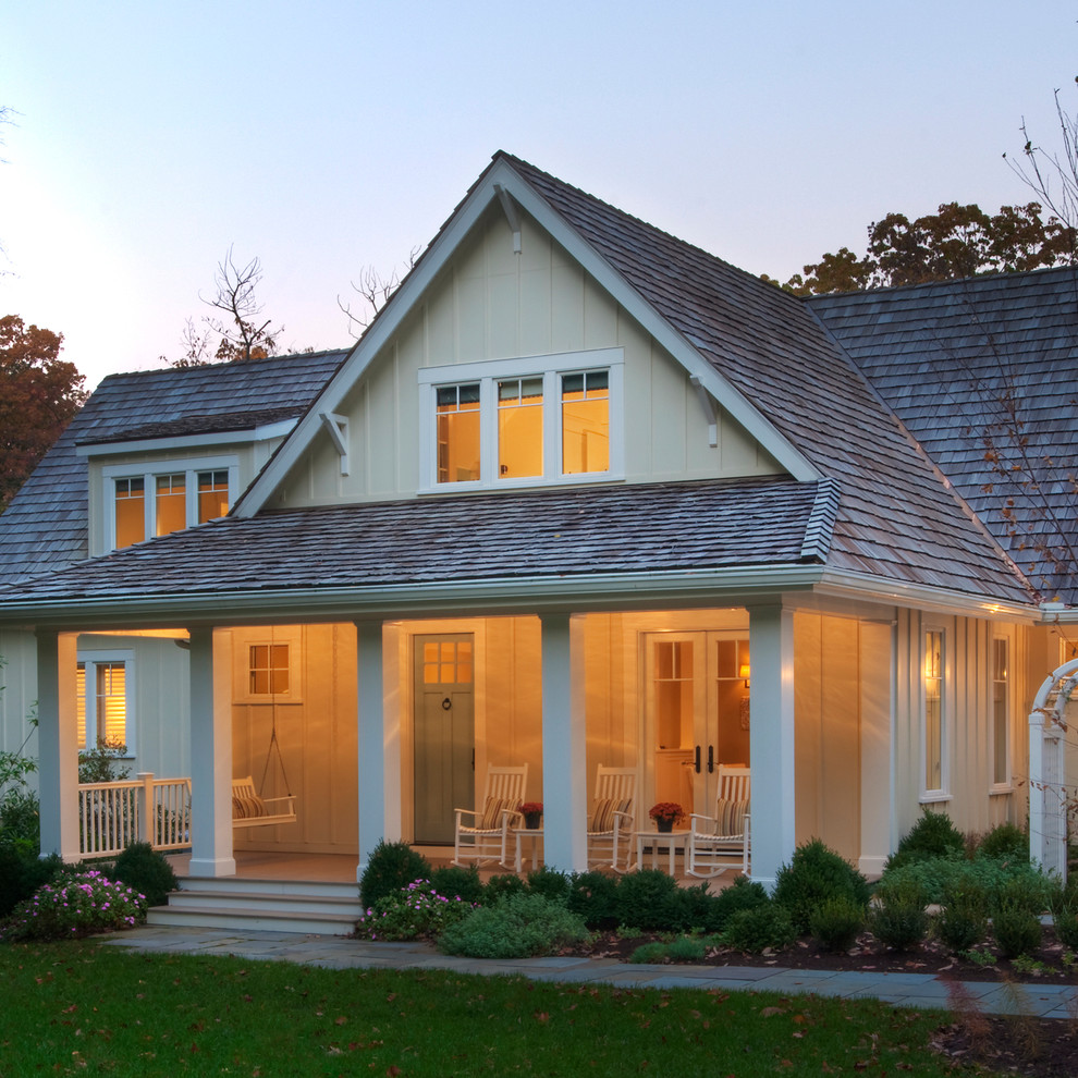 Inspiration for a coastal yellow two-story gable roof remodel in DC Metro