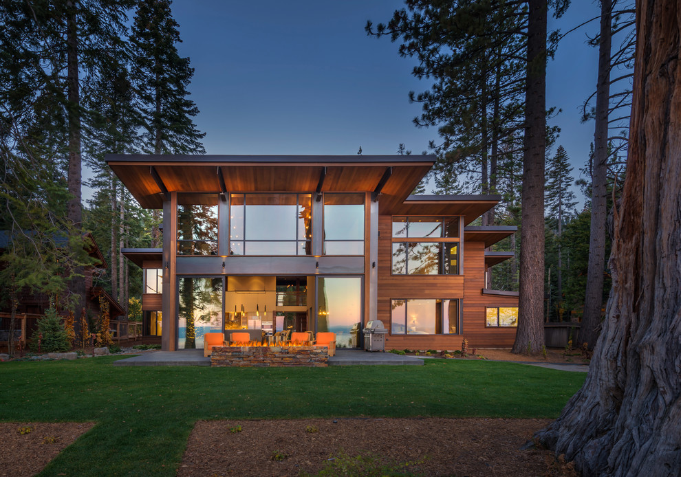 Example of a mountain style two-story wood flat roof design in Sacramento