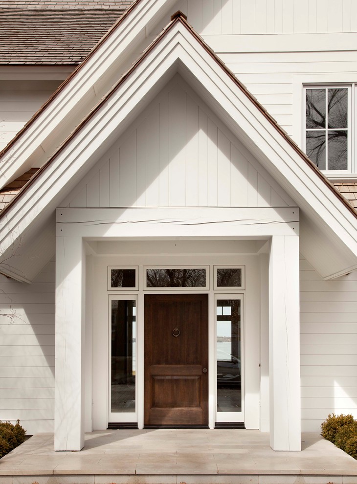 Example of a transitional white wood gable roof design in Minneapolis