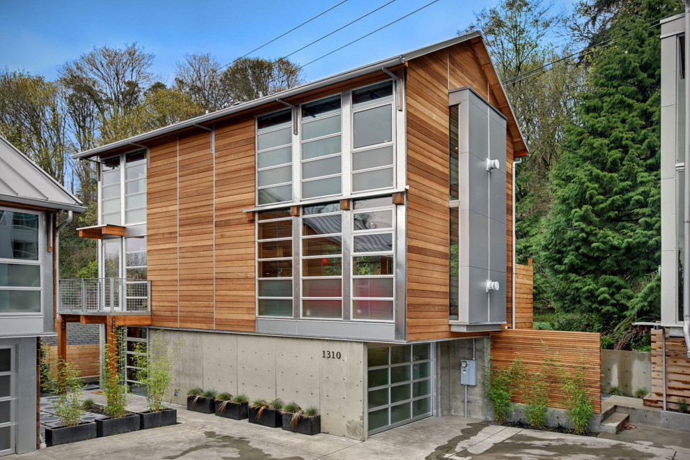 Trendy brown two-story wood exterior home photo in Seattle