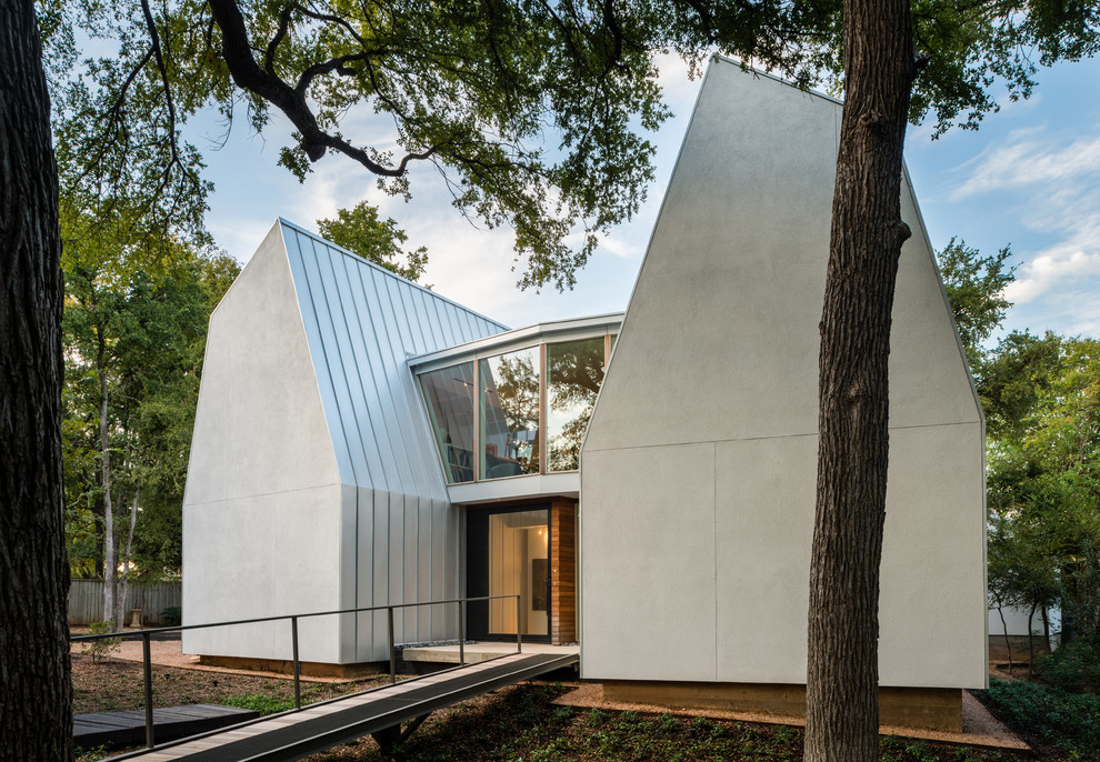 Inspiration for a white modern two floor house exterior in Austin.