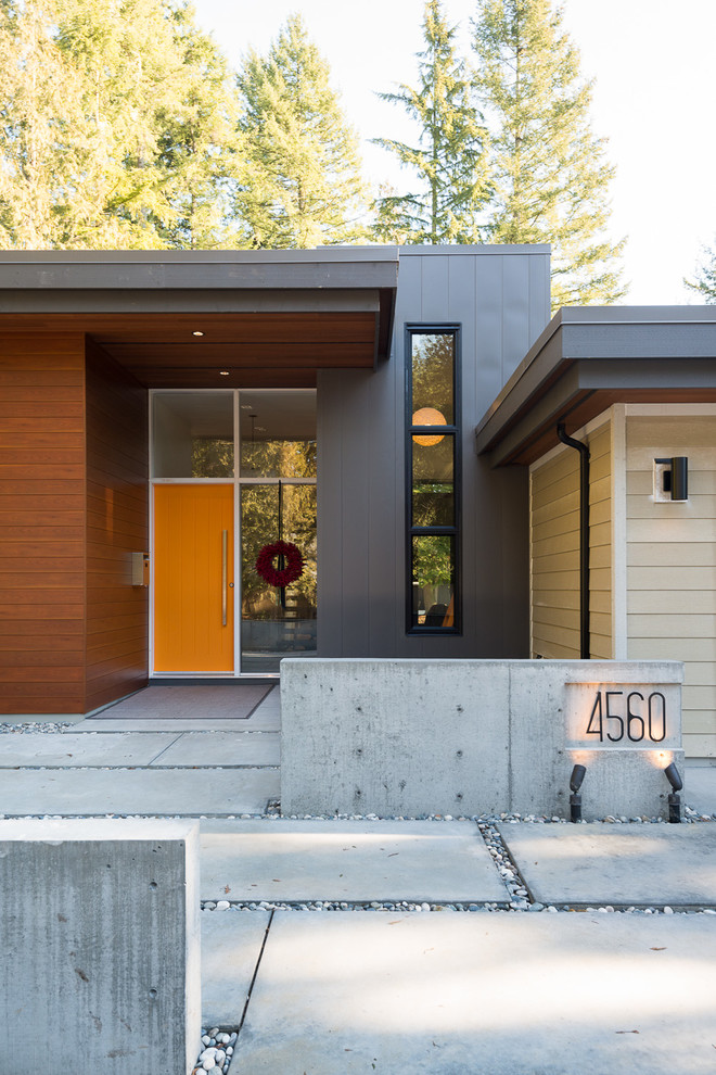 Inspiration for a contemporary wood exterior home remodel in Vancouver