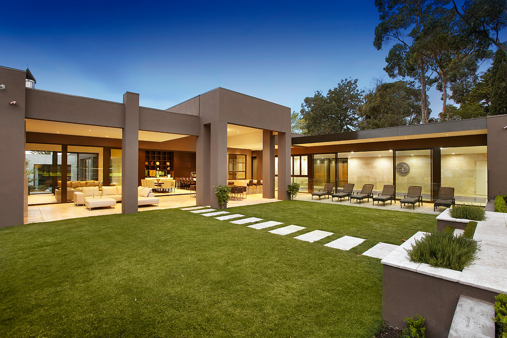 This is an example of a brown contemporary bungalow house exterior in Melbourne.