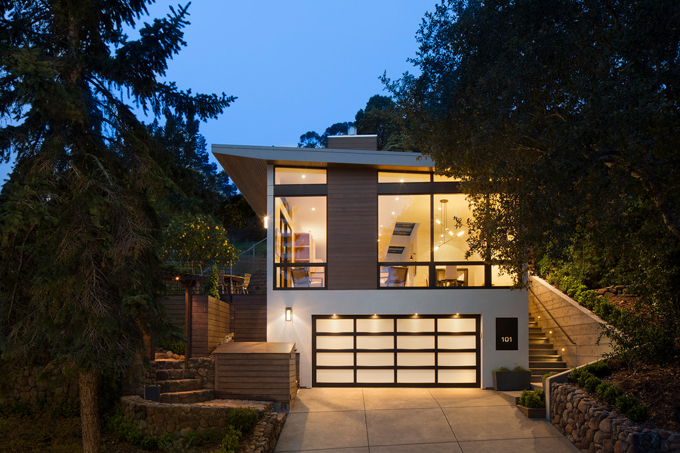 Design ideas for a white contemporary two floor house exterior in San Francisco with mixed cladding and a lean-to roof.