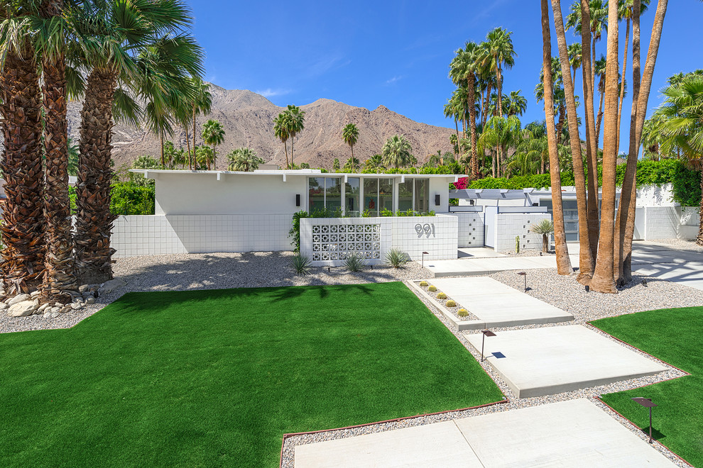 White retro bungalow house exterior in Los Angeles with a flat roof.