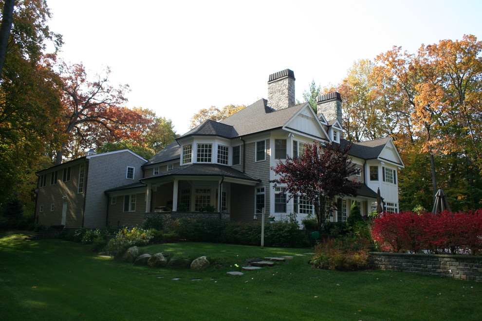 Inspiration for a large transitional beige exterior home remodel in New York