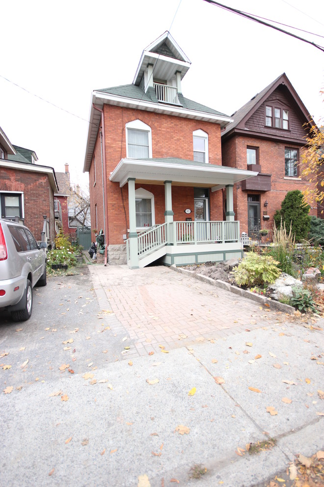 Medium sized and red classic two floor brick house exterior in Ottawa.
