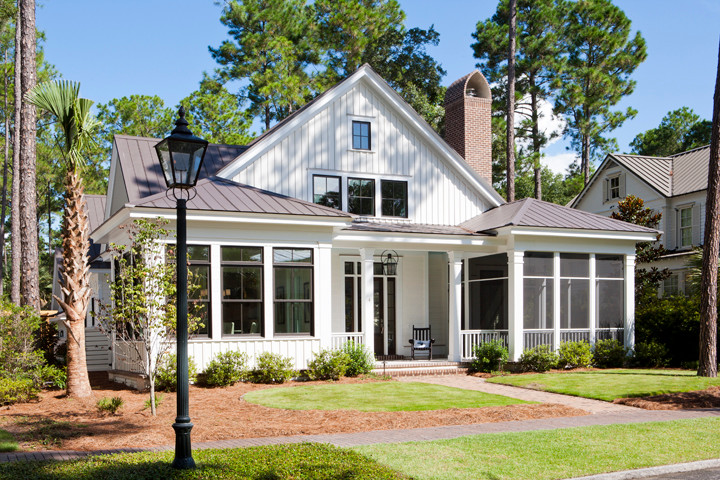 Example of a mid-sized beach style white two-story concrete fiberboard exterior home design in Charleston
