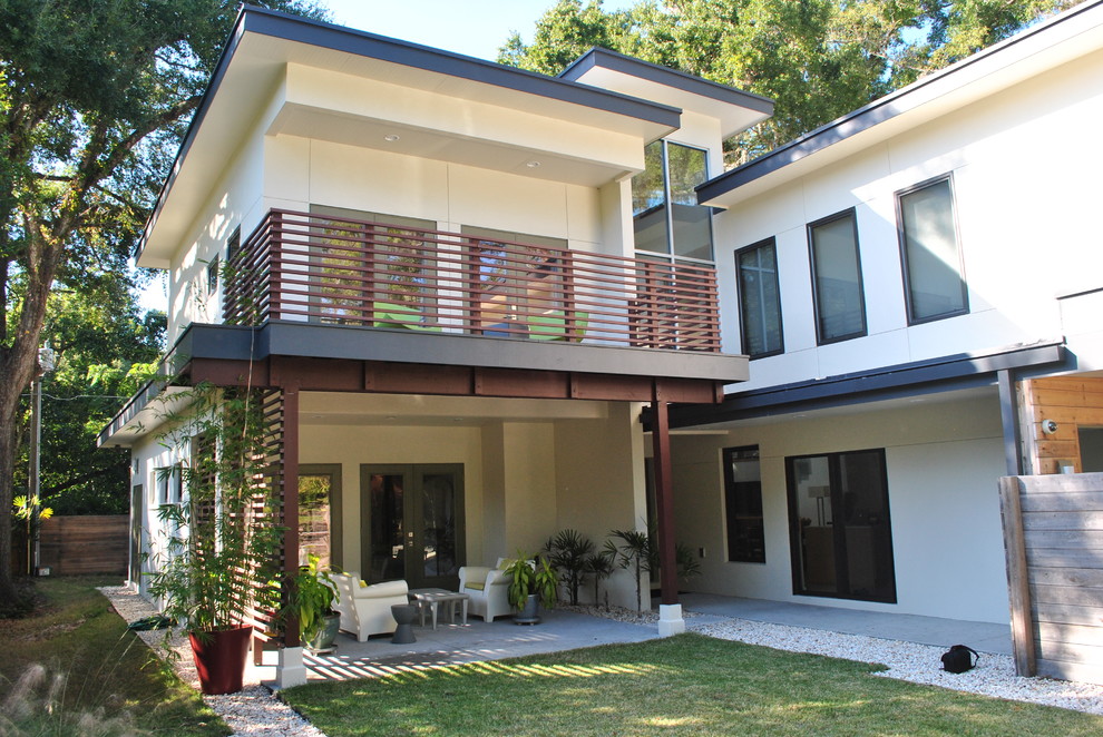 Example of a trendy two-story exterior home design in Orlando