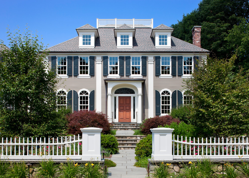 Design ideas for a large and brown traditional house exterior in Boston with three floors.