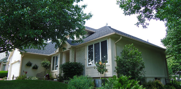 Inspiration for a large traditional two floor house exterior in Minneapolis with mixed cladding.