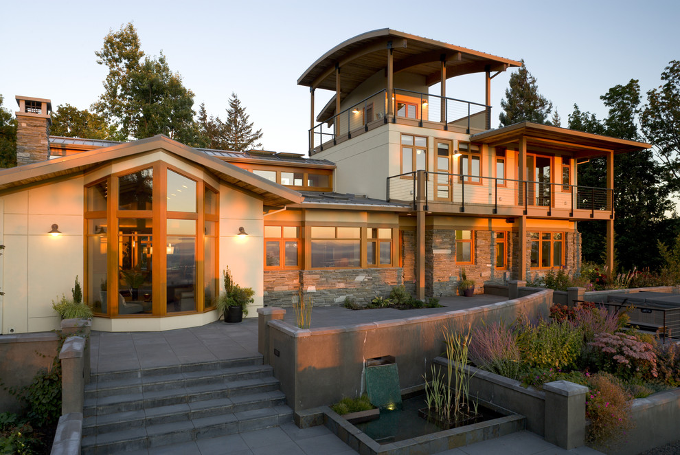 Inspiration for a contemporary house exterior in Portland with three floors.