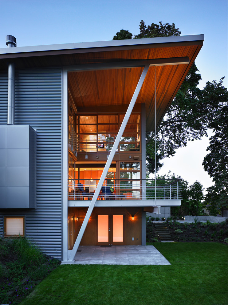 Inspiration for a contemporary house exterior in Seattle with metal cladding.
