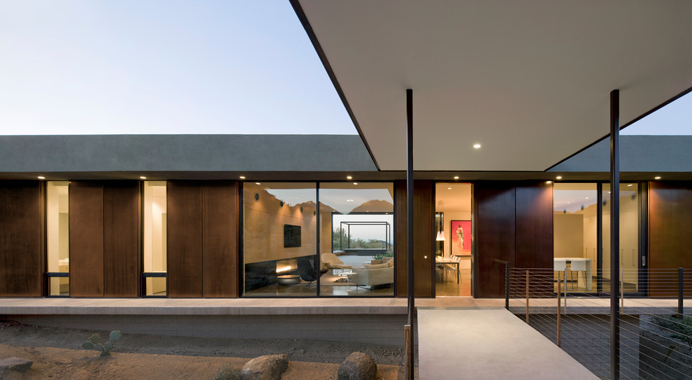 Idée de décoration pour une façade de maison métallique minimaliste de plain-pied.