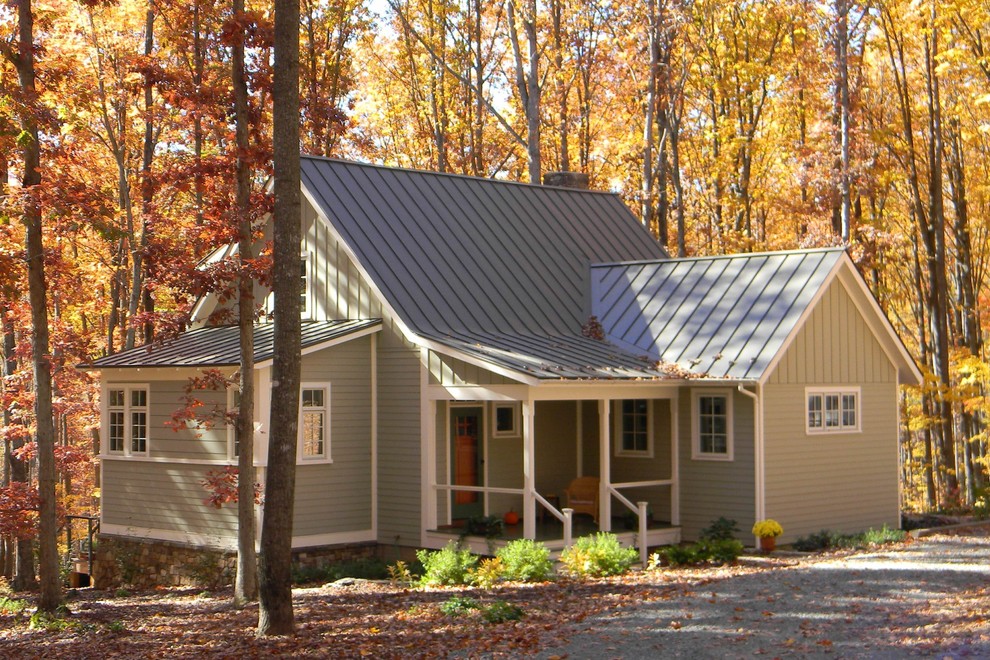 Example of a small classic two-story exterior home design in Other with a metal roof