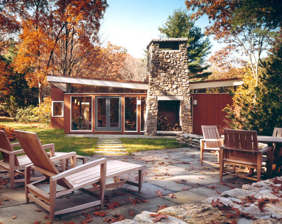 Inspiration for a mid-sized modern brown one-story wood flat roof remodel in Boston
