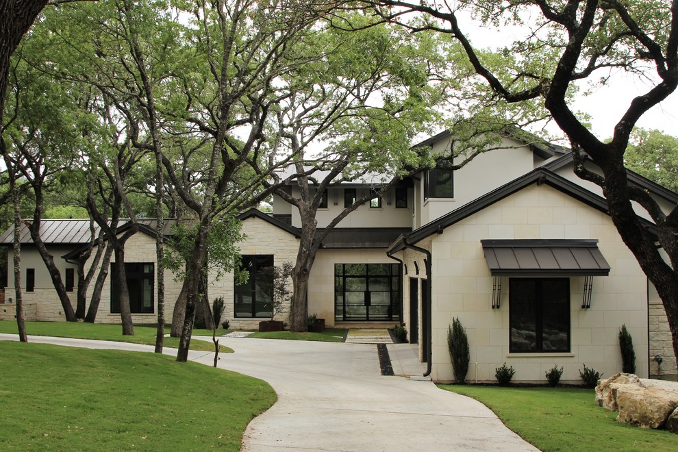 Example of a large transitional exterior home design in Austin