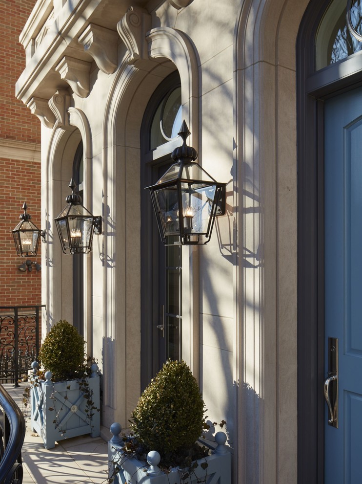 Inspiration for an expansive and beige classic house exterior in Chicago with three floors, stone cladding and a flat roof.