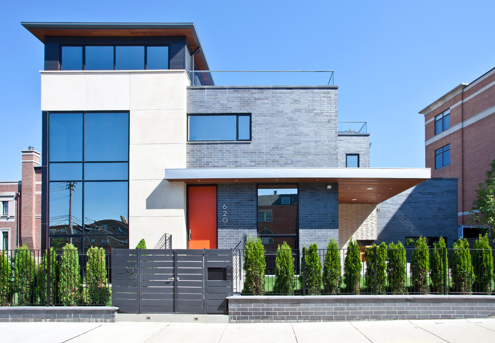 Imagen de fachada gris contemporánea de dos plantas