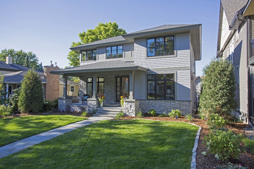 Large transitional gray two-story mixed siding house exterior photo in Minneapolis with a hip roof and a shingle roof