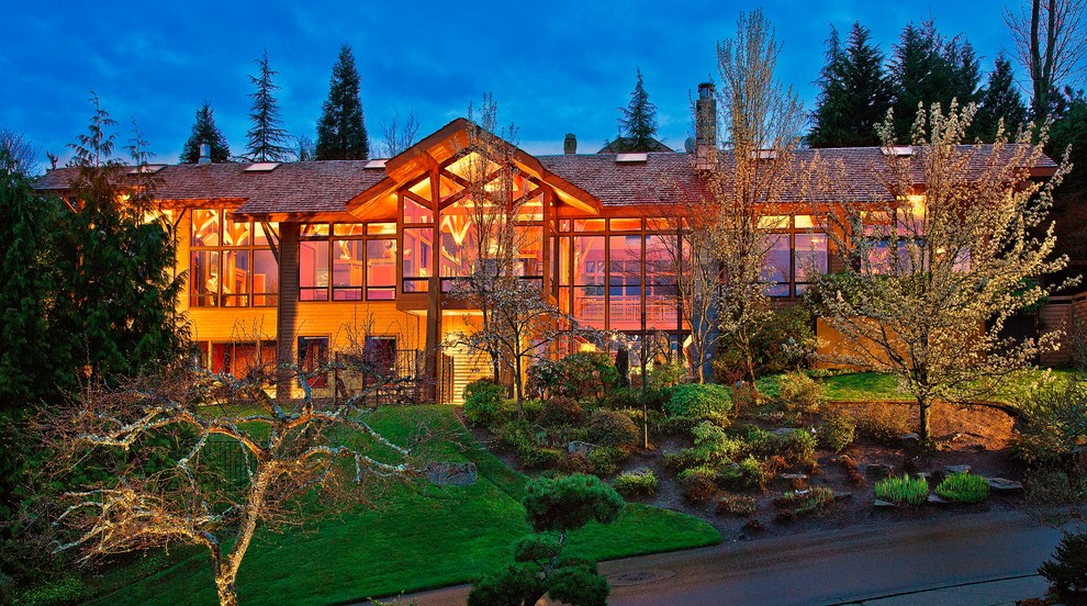 Mountain style two-story wood exterior home photo in Seattle