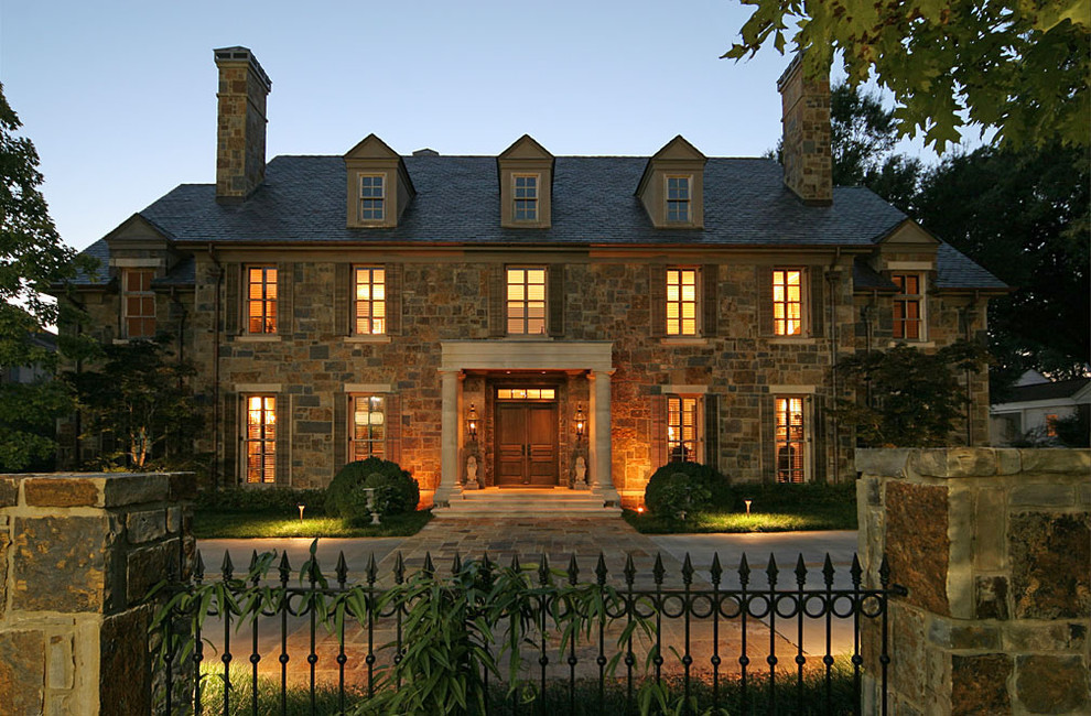 Photo of a medium sized and beige classic house exterior in Little Rock with three floors, stone cladding and a pitched roof.