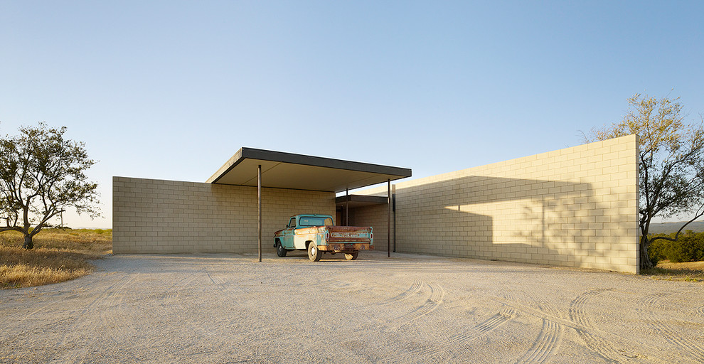 Ejemplo de fachada minimalista de una planta con tejado plano