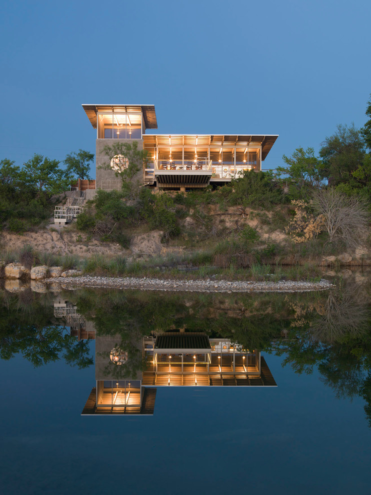 Inspiration for a small contemporary gray two-story metal exterior home remodel in Austin