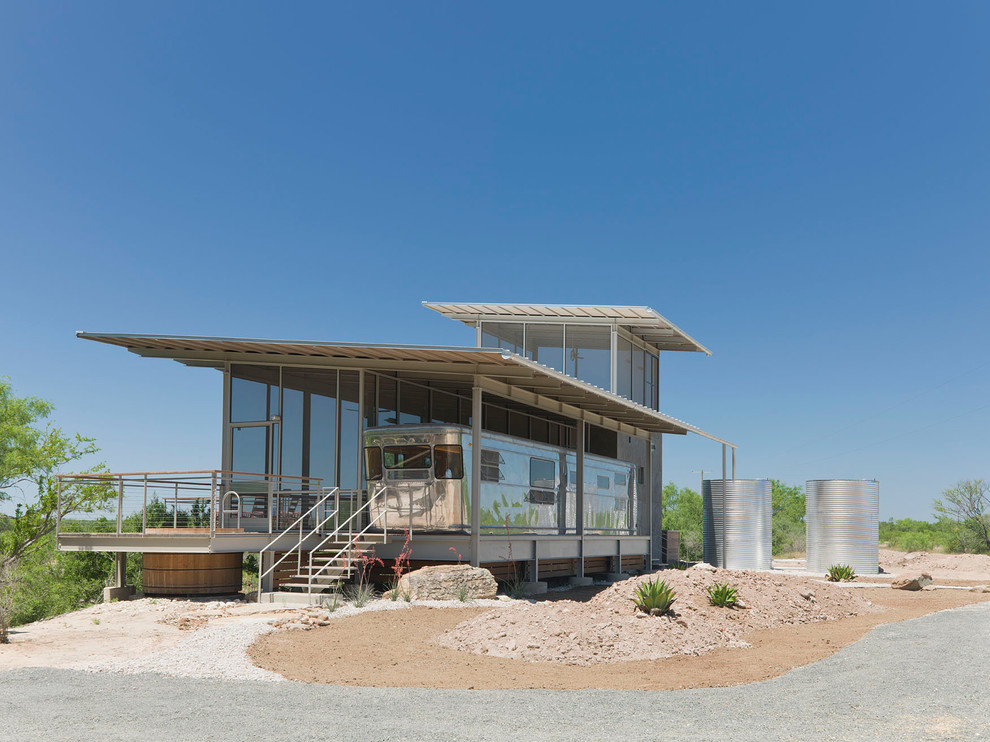 Inspiration for a modern glass exterior home remodel in Austin