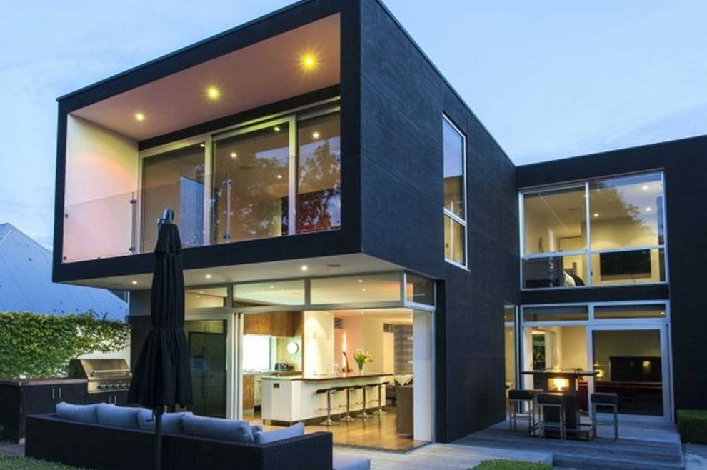 Mid-sized modern black two-story stucco house exterior idea in Los Angeles