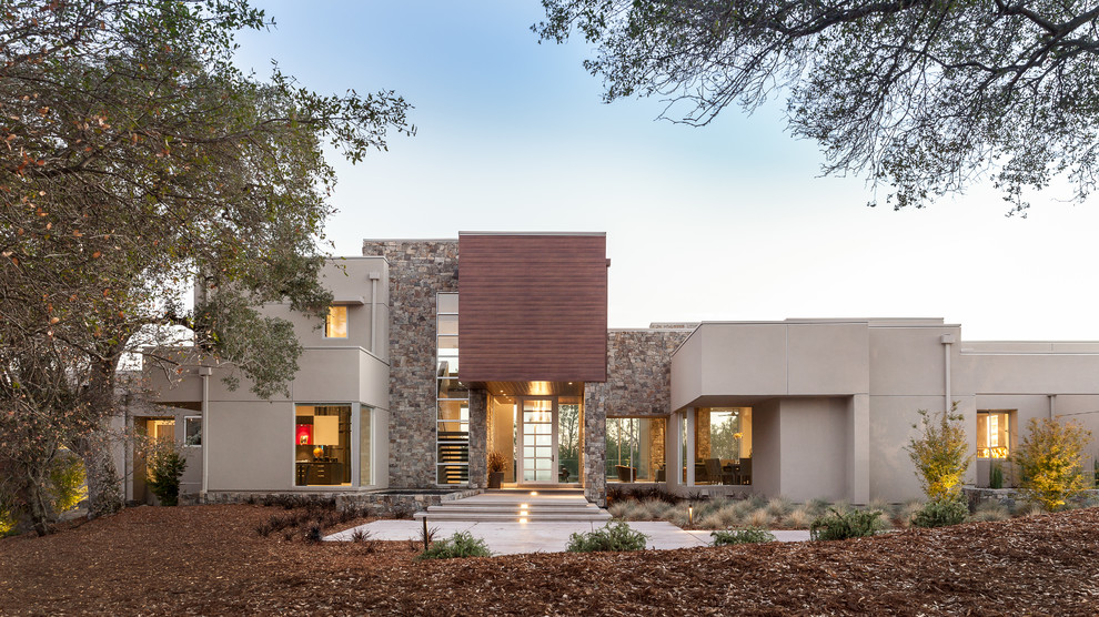 Inspiration for a large contemporary white two-story mixed siding exterior home remodel in Sacramento