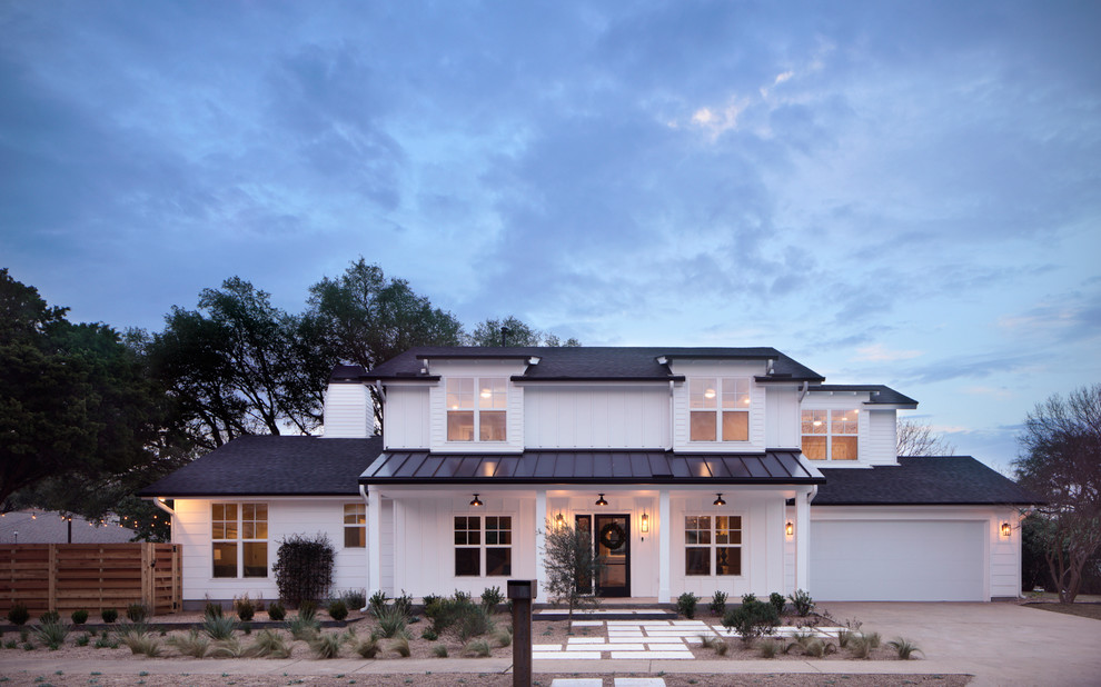 Large farmhouse white two-story mixed siding exterior home idea in Austin with a mixed material roof