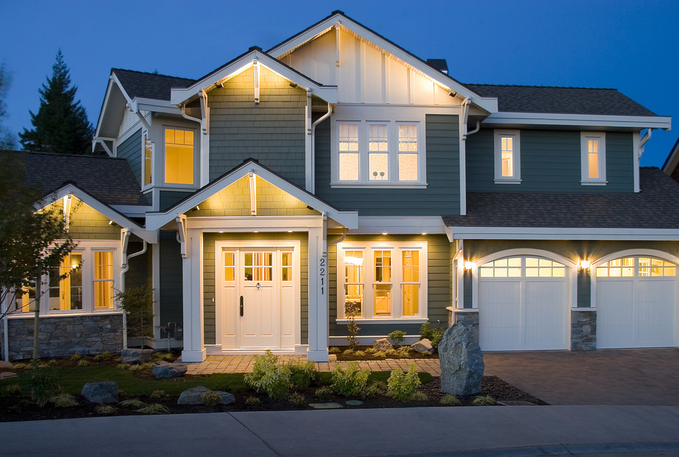 Mid-sized elegant three-story wood exterior home photo in Vancouver