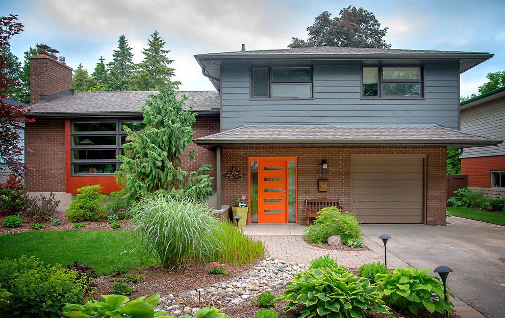 Modern gray split-level concrete fiberboard exterior home idea in Toronto